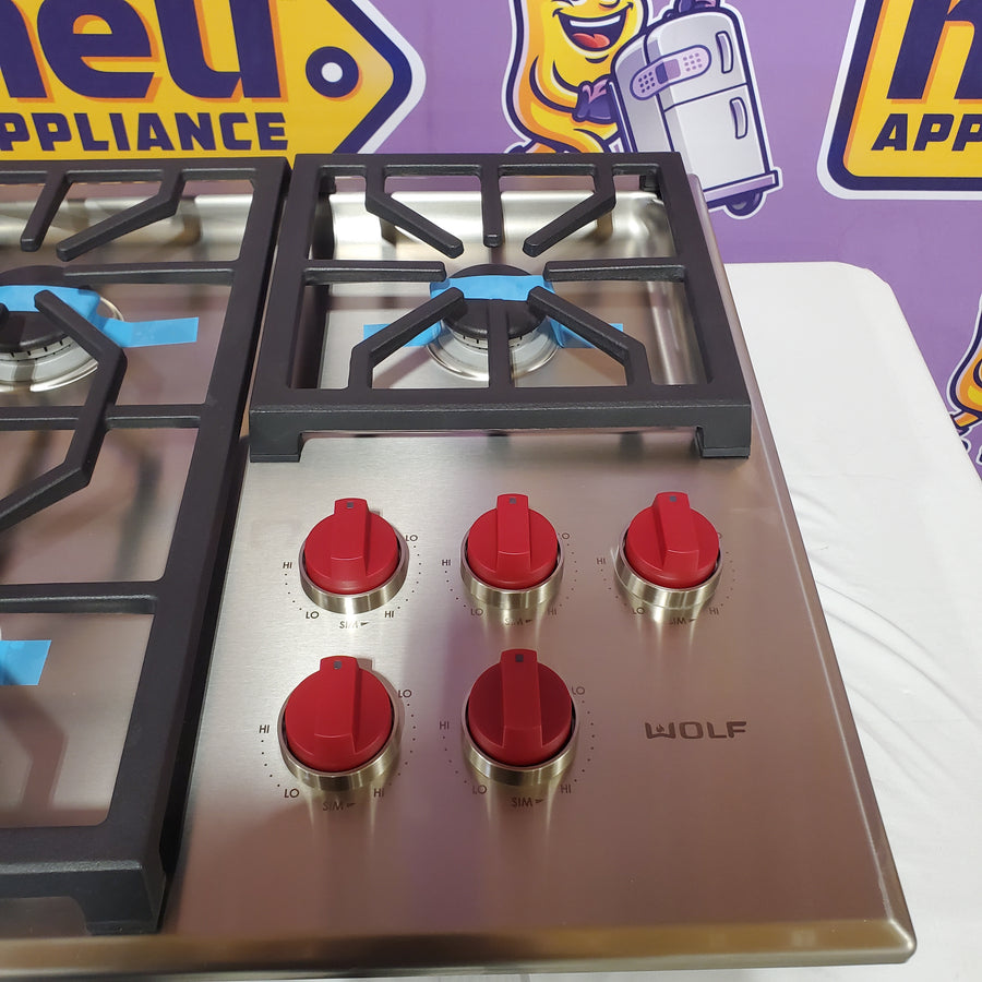 Wolf 36 Inch Gas Cooktop with 5 Dual-Stacked Sealed Burners, Continuous Grates, True Simmer Settings, Automatic Reignition, and Illuminated Controls CG365PS - Open Box