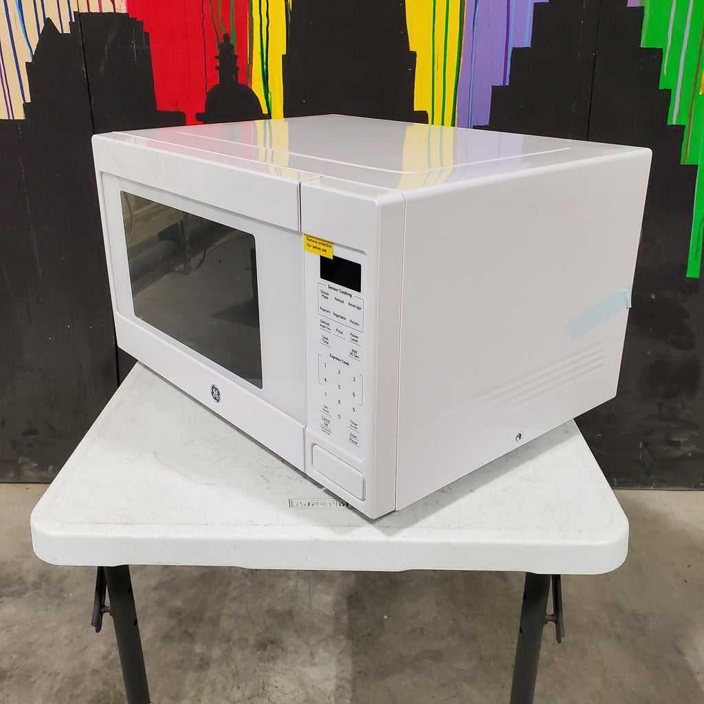 Pictures of White GE 1.6 cu. ft. Countertop Microwave Oven with Sensor Cooking Controls - Scratch & Dent - Minor - Neu Appliance Outlet - Discount Appliance Outlet in Austin, Tx
