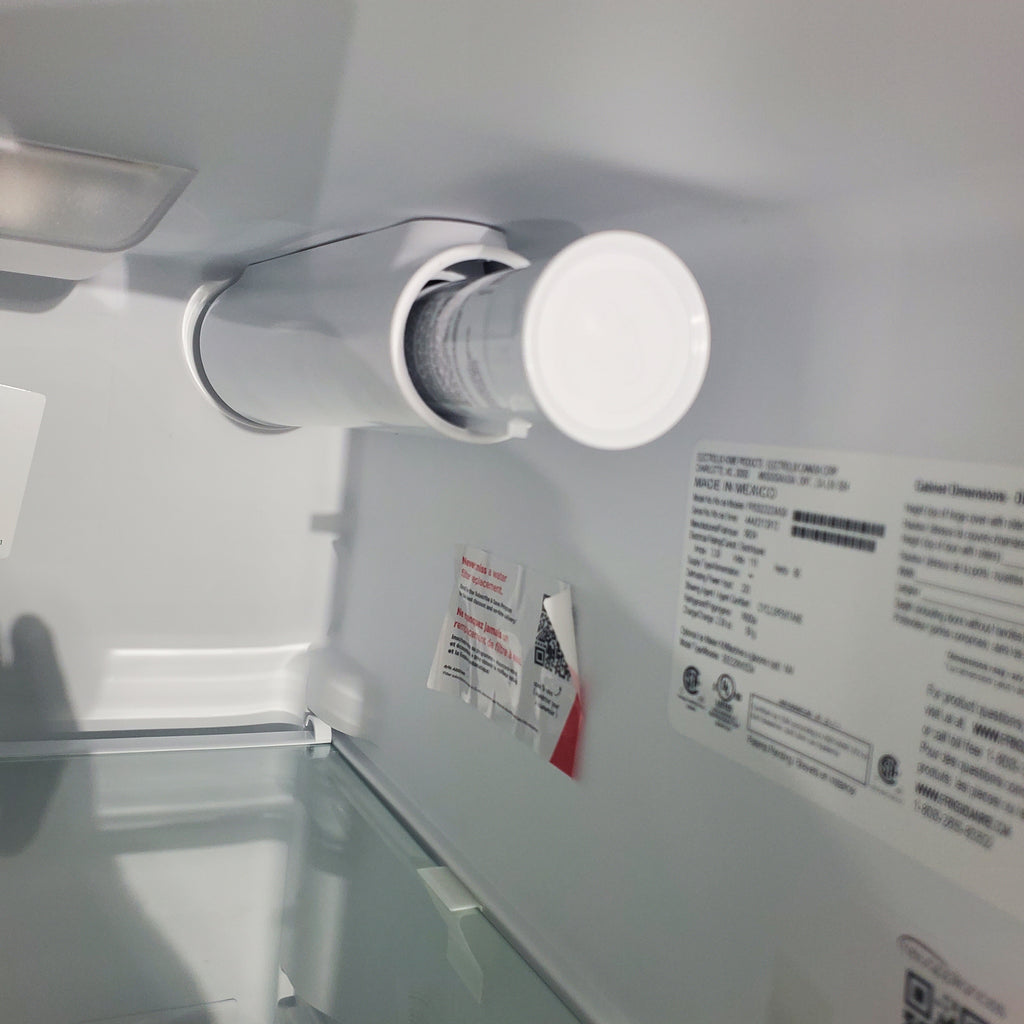 Pictures of 33" Wide Stainless Steel Frigidaire 22.3 cu. ft. ENERGY STAR Side by Side Refrigerator with Exterior Water and Ice Dispenser - Scratch & Dent - Minor - Neu Appliance Outlet - Discount Appliance Outlet in Austin, Tx