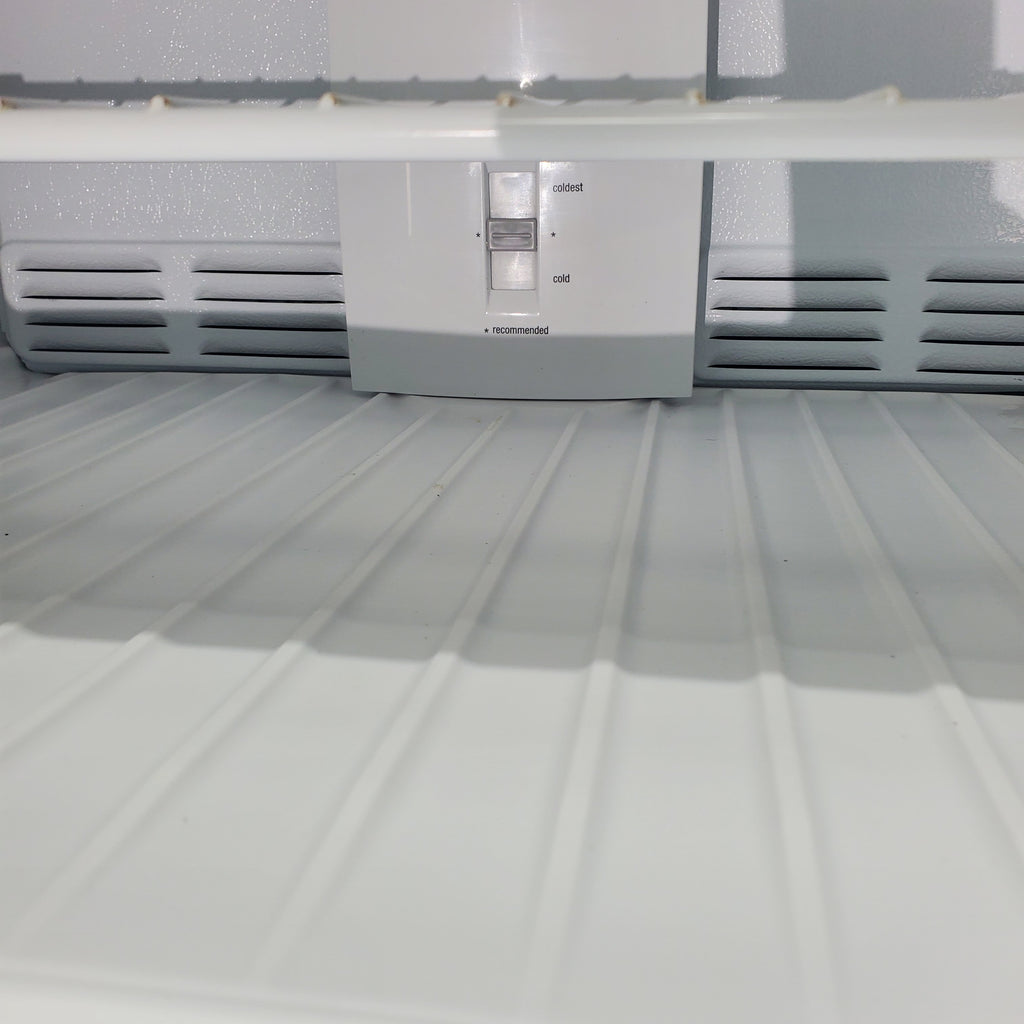 Pictures of 30 in. Wide Black Frigidaire 18 cu. ft. Top Freezer Refrigerator with Reversible Doors - Certified Refurbished - Neu Appliance Outlet - Discount Appliance Outlet in Austin, Tx