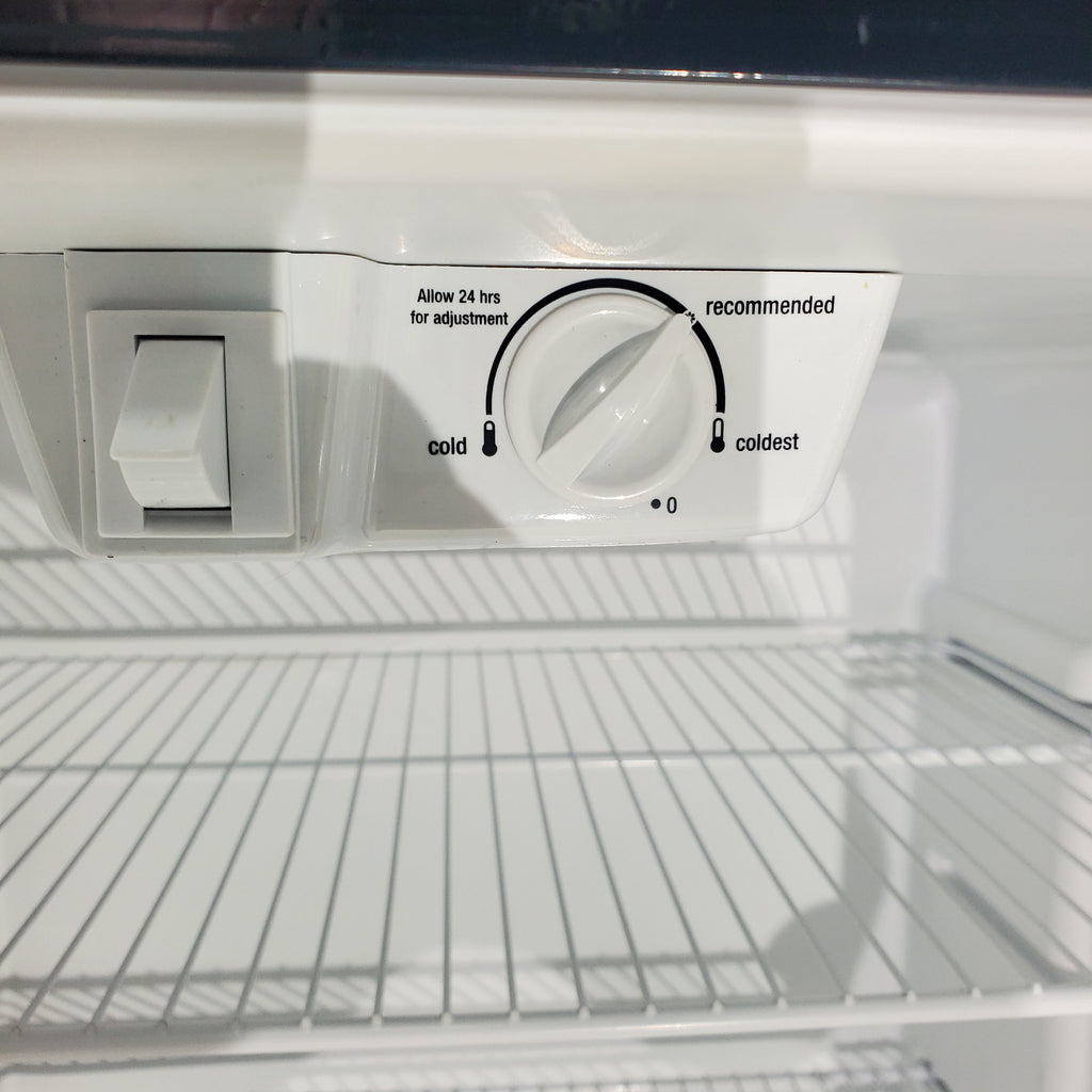 Pictures of 30 in. Wide Black Frigidaire 18 cu. ft. Top Freezer Refrigerator with Reversible Doors - Certified Refurbished - Neu Appliance Outlet - Discount Appliance Outlet in Austin, Tx