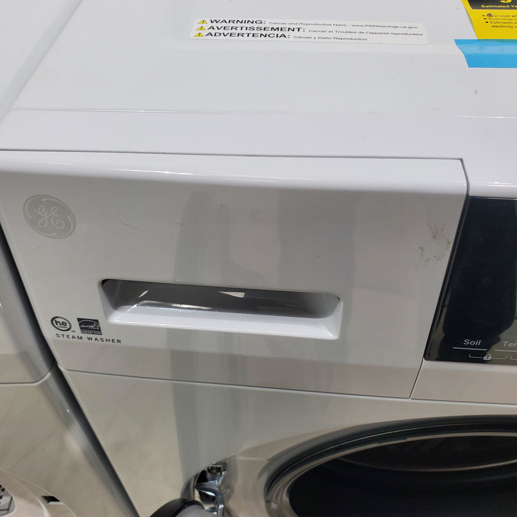 Pictures of Compact 24 in. Wide GE ENERGY STAR 2.4 cu. ft. Front Load Steam Washing Machine with 1400 RPM Spin Speed and Frontload Vented WiFi Capable ENERGY STAR 4.3 cu. ft. Electric Dryer with Stainless Steel Basket - Scratch & Dent - Minor - Neu Appliance Outlet - Discount Appliance Outlet in Austin, Tx