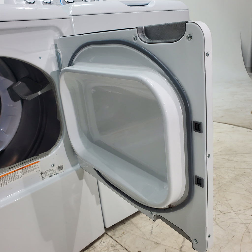 Pictures of ENERGY STAR GE 4.6 cu. ft. Top Load Washing Machine with Stainless Steel Basket and 7.2 cu. ft. Electric Dryer with HE Sensor Dry - Scratch & Dent - Minor - Neu Appliance Outlet - Discount Appliance Outlet in Austin, Tx