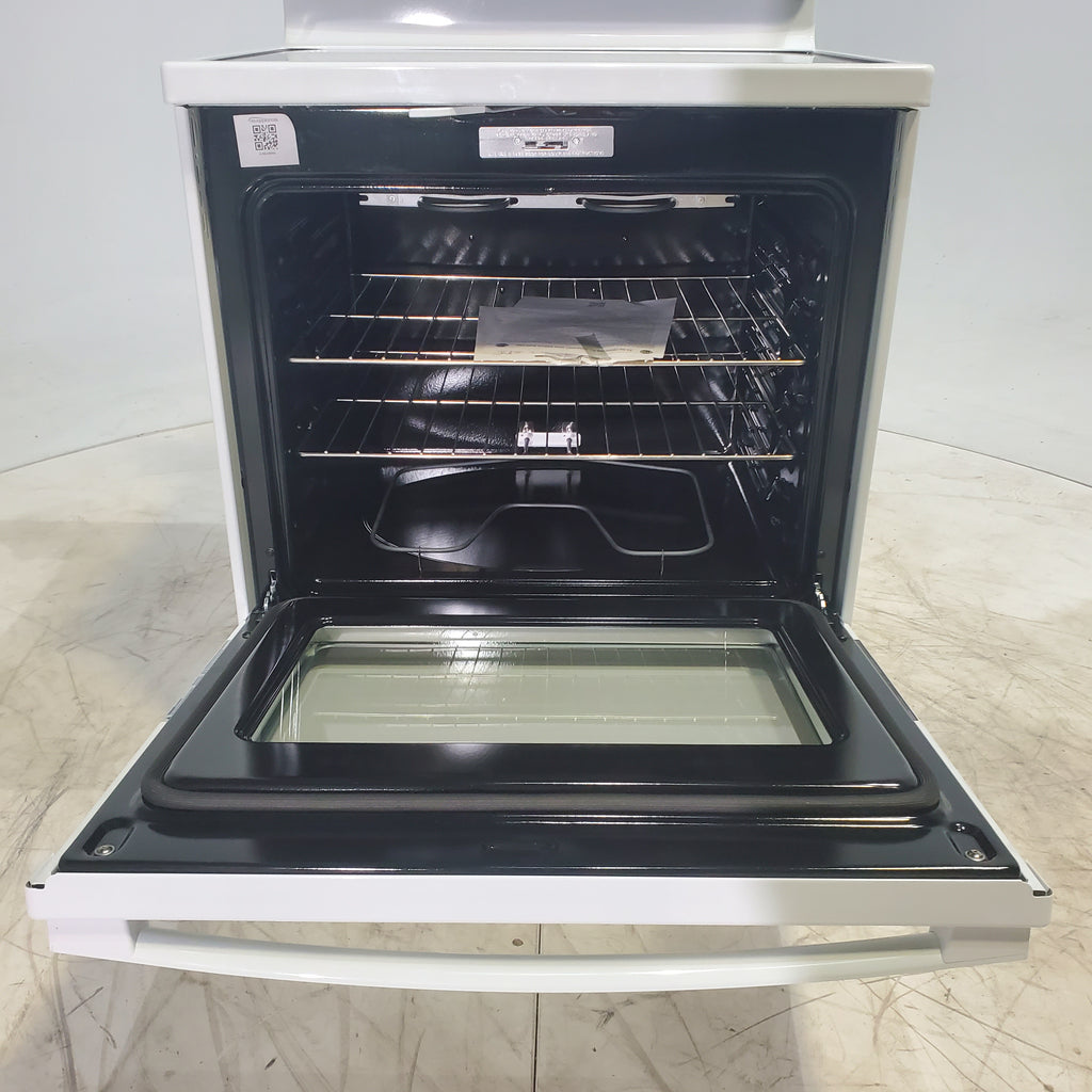 Pictures of White GE 5.3 cu. ft. 4 Element Freestanding Electric Range with Dual Element Baking - Scratch & Dent - Minor - Neu Appliance Outlet - Discount Appliance Outlet in Austin, Tx