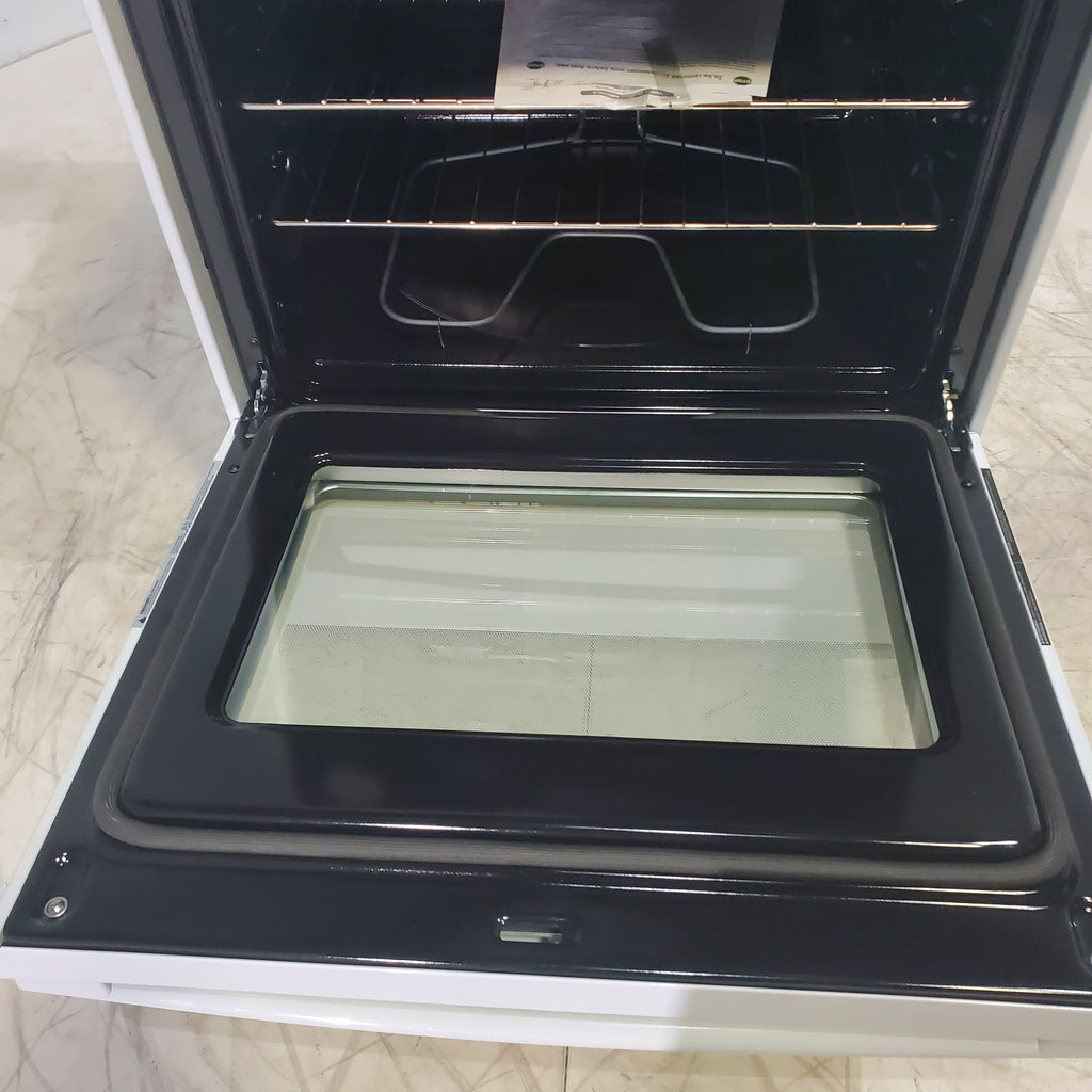 Pictures of White GE 5.3 cu. ft. 4 Element Freestanding Electric Range with Dual Element Baking - Scratch & Dent - Minor - Neu Appliance Outlet - Discount Appliance Outlet in Austin, Tx