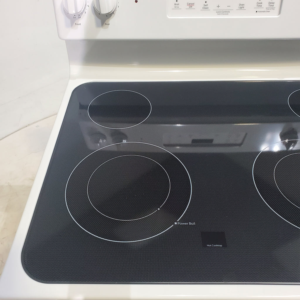 Pictures of White GE 5.3 cu. ft. 4 Element Freestanding Electric Range with Dual Element Baking - Scratch & Dent - Minor - Neu Appliance Outlet - Discount Appliance Outlet in Austin, Tx
