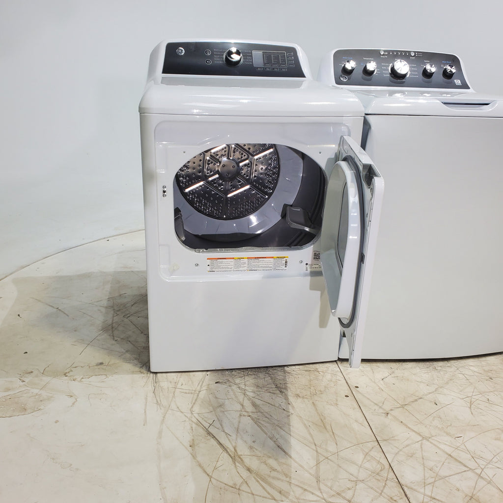Pictures of GE 4.5 cu. ft. Capacity Washer with Stainless Steel Basket, Cold Plus and Wash Boost and GE 7.4 cu. ft. Capacity Electric Dryer with Up To 120 ft. Venting and Sensor Dry - Scratch & Dent - Minor | Moderate - Neu Appliance Outlet - Discount Appliance Outlet in Austin, Tx