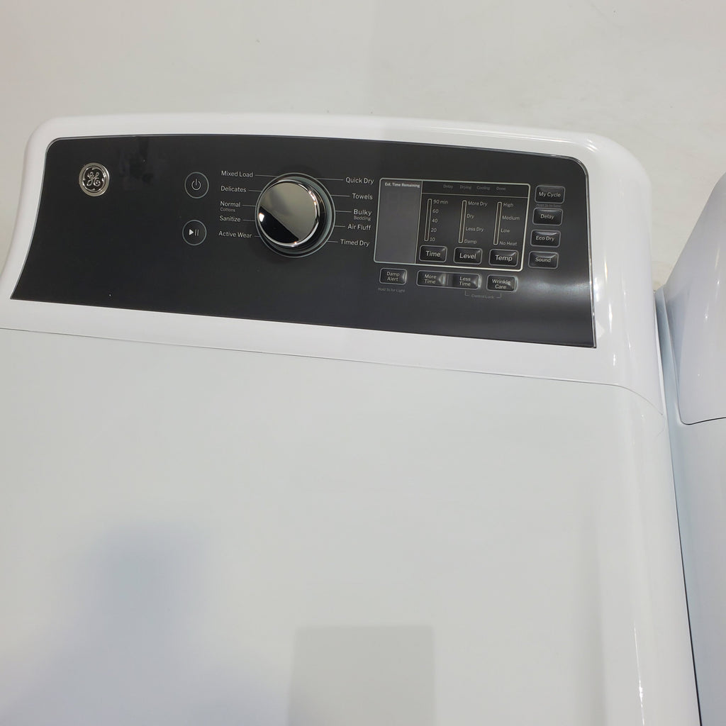 Pictures of GE 4.5 cu. ft. Capacity Washer with Stainless Steel Basket, Cold Plus and Wash Boost and GE 7.4 cu. ft. Capacity Electric Dryer with Up To 120 ft. Venting and Sensor Dry - Scratch & Dent - Minor | Moderate - Neu Appliance Outlet - Discount Appliance Outlet in Austin, Tx