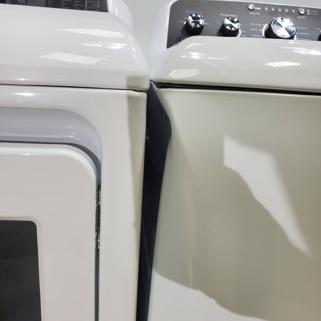 Pictures of GE 4.5 cu. ft. Capacity Washer with Stainless Steel Basket, Cold Plus and Wash Boost and GE 7.4 cu. ft. Capacity Electric Dryer with Up To 120 ft. Venting and Sensor Dry - Scratch & Dent - Minor | Moderate - Neu Appliance Outlet - Discount Appliance Outlet in Austin, Tx