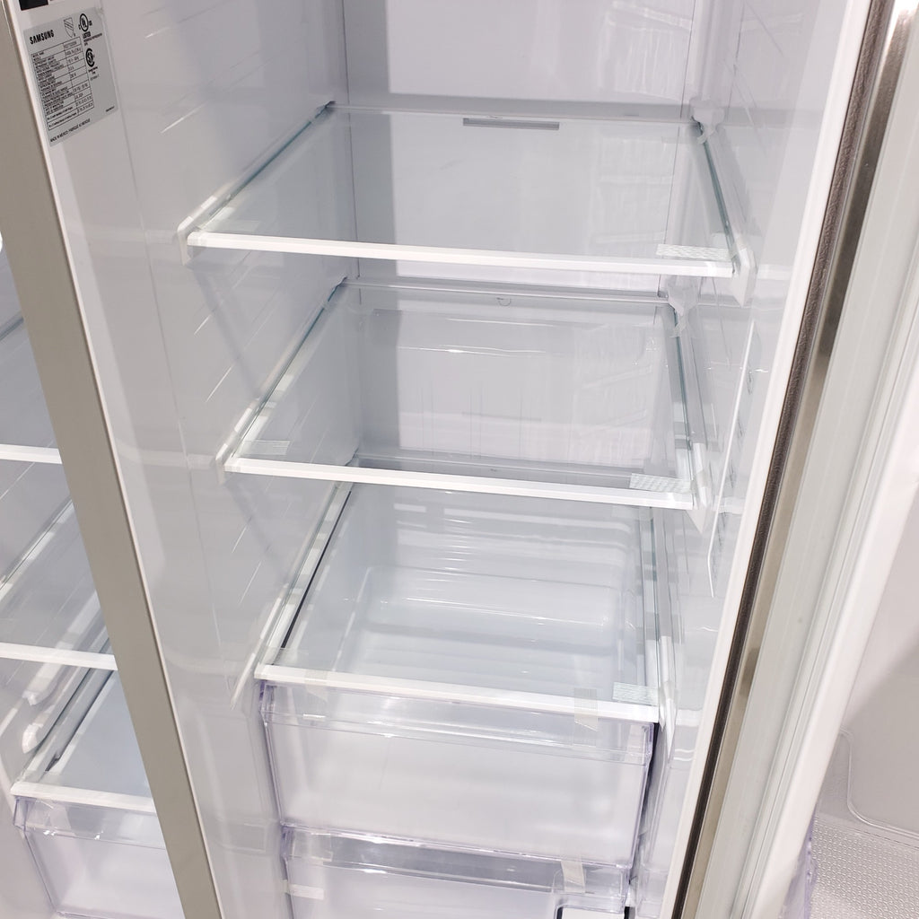 Pictures of Fingerprint Resistant Stainless Steel ENERGY STAR Samsung 27.4 cu. ft. Side by Side Refrigerator with Exterior Water and Ice Dispenser - Scratch & Dent - Moderate - Neu Appliance Outlet - Discount Appliance Outlet in Austin, Tx