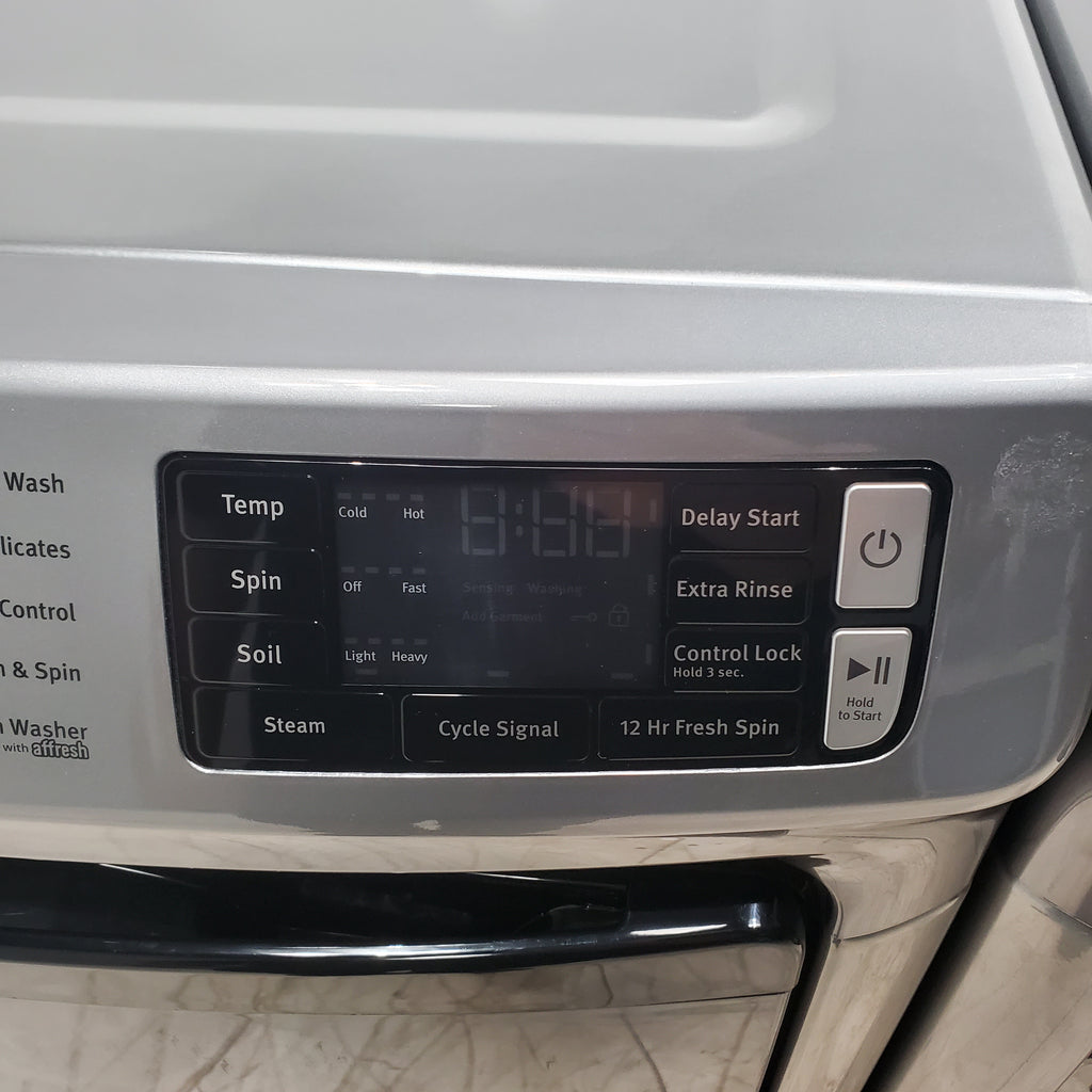 Pictures of Maytag Metallic Slate 4.5-cu ft High Efficiency ENERGY STAR Stackable Steam Cycle Front-Load Washer with Maytag® Commercial Technology and Maytag 7.3-cu ft Stackable Vented ENERGY STAR Electric Dryer - Scratch & Dent - Minor - Neu Appliance Outlet - Discount Appliance Outlet in Austin, Tx