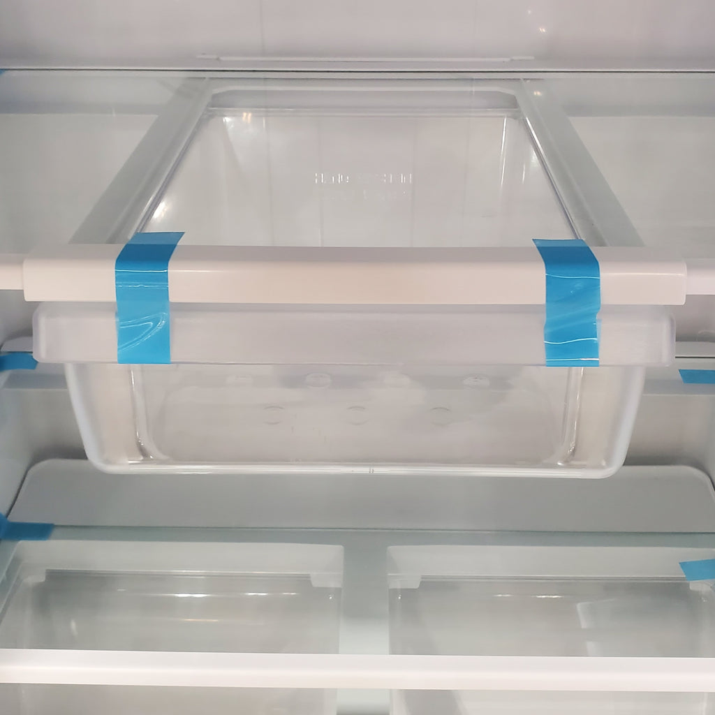 Pictures of Fingerprint Stainless Steel GE 21.9 cu. ft. Top Freezer Refrigerator with Garage Ready Technology GTS22KYNCRFS - Scratch & Dent - Minor - Neu Appliance Outlet - Discount Appliance Outlet in Austin, Tx