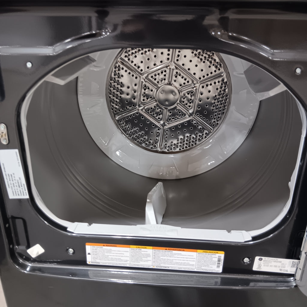 GE PTD60EBPRDG Dryer drum with open door showing internal components