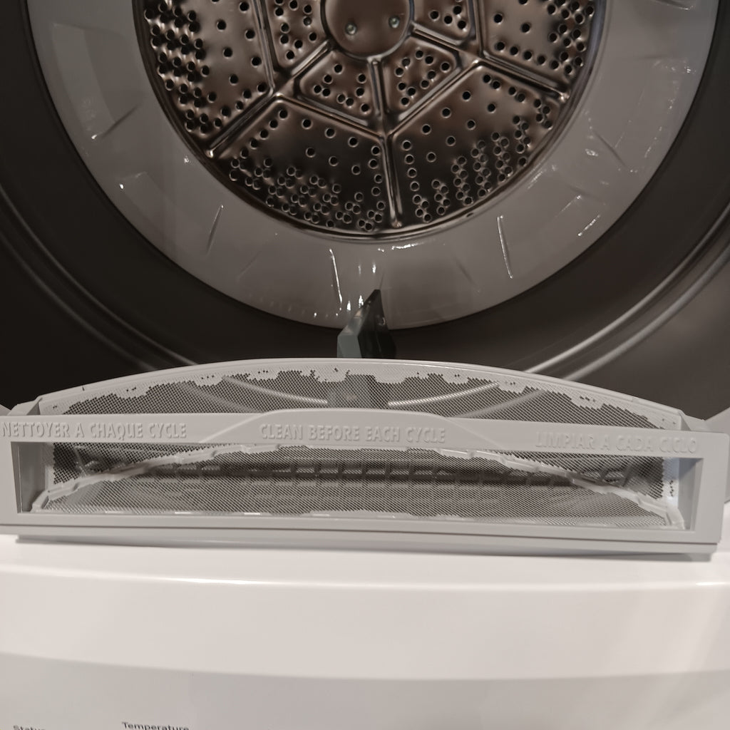 GUD27ESSMWW Close-up of a dryer drum with a mesh screen on a white background