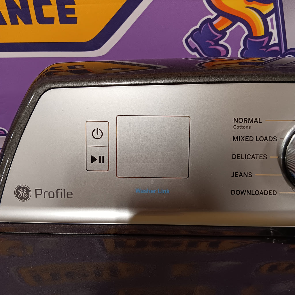 GE PTD60EBPRDG Close-up of a GE Profile dryer control panel with a colorful box in the background.