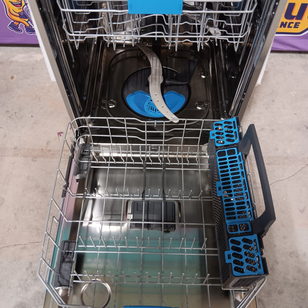 GE PDT715SYVFS Open dishwasher with blue racks and a visible brand logo on the door.