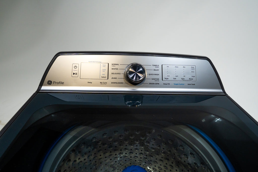 GE PTW605BPRDG Top view of a washing machine with control panel on a light gray background