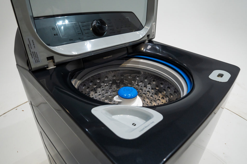 GE PTW605BPRDG Top-loading washing machine with open door on a white background