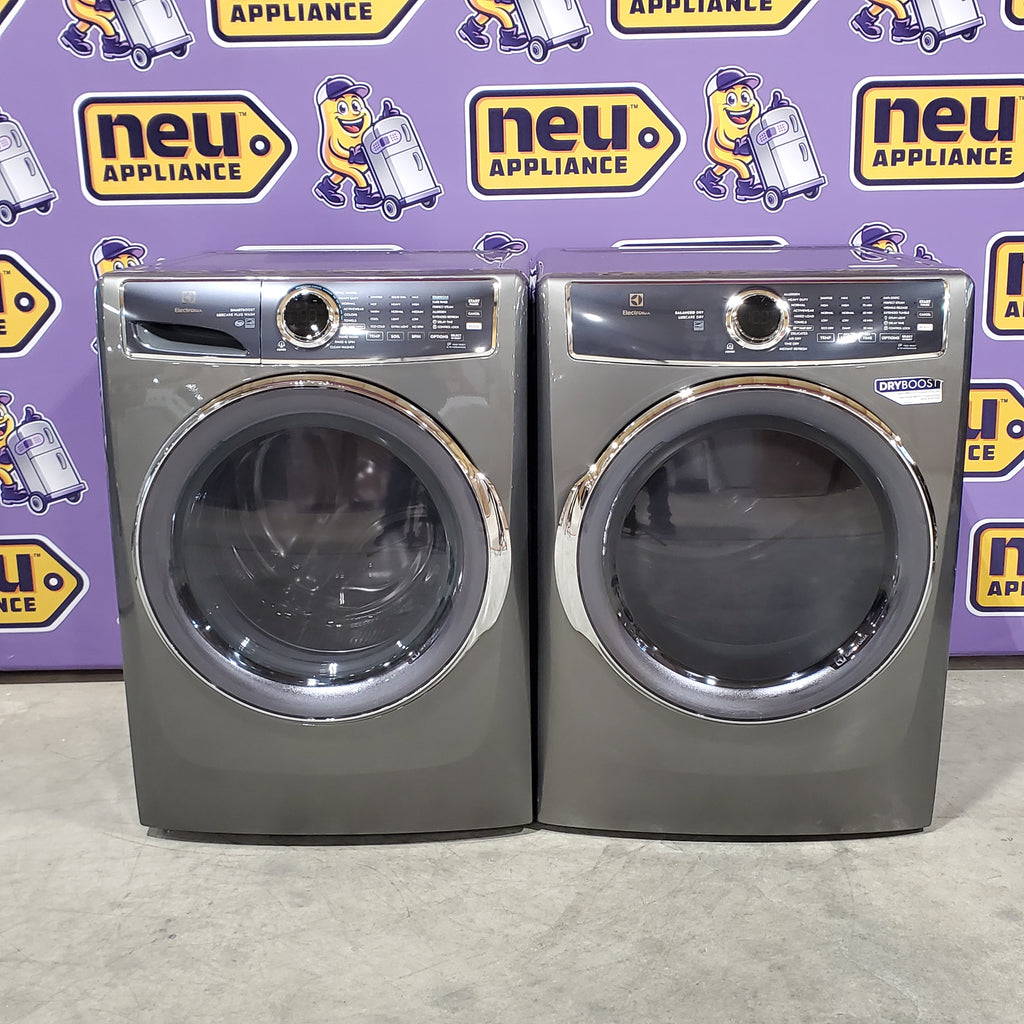 Electrolux Titanium Front Load 600 Series 4.5 Cu. Ft. Washer with Smartboost ELFW7637AT - Scratch & Dent (Minor) and Electrolux 8 cu. ft. vented Front Load Stackable 600 Series Electric Dryer with LuxCare Dry 16098 - ELFE7637AT - Scratch & Dent (Moderate)