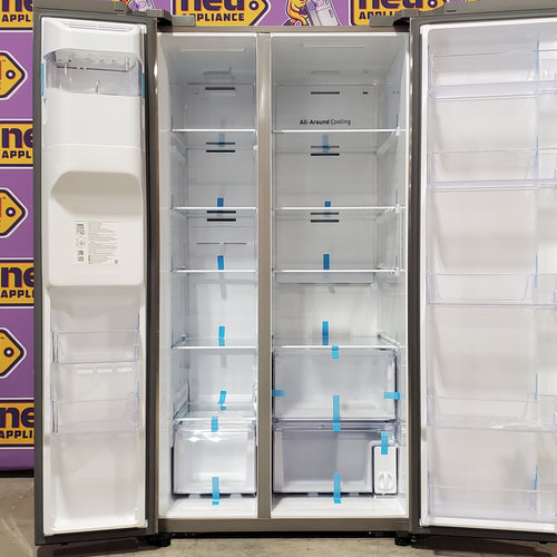Stainless steel Samsung RS27T5200SR Refrigerator against a purple background with 'new appliance' branding.