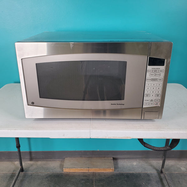 Stainless Steel GE. 2.2 cu. ft. Countertop Microwave Oven with Inverter Defrost Technology - Open Box