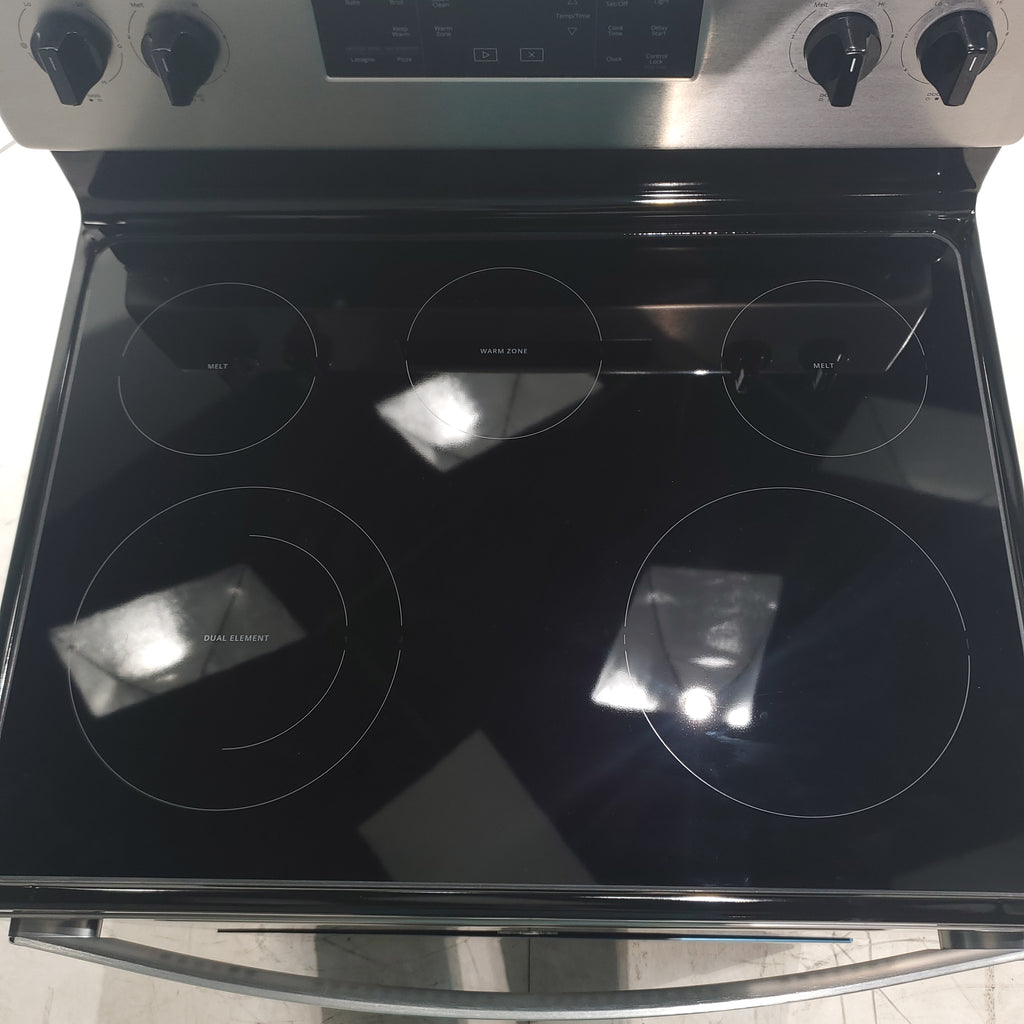 Pictures of Fingerprint Resistant Stainless Steel Whirlpool 5.3 cu. ft. Freestanding 5 Heating Element Smooth Cooktop Electric Range with Frozen Bake Technology Scratch & Dent - Minor - Neu Appliance Outlet - Discount Appliance Outlet in Austin, Tx