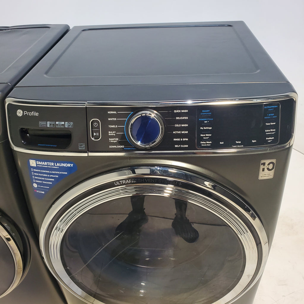 Pictures of GE Profile 5.3 cu. ft. Smart Front Load Washer in Carbon Graphite with OdorBlock UltraFresh Vent System and Steam and  GE® ENERGY STAR® 7.8 cu. ft. Capacity Smart Front Load Electric Dryer with Steam and Sanitize Cycle - Scratch and Dent - Moderate - Neu Appliance Outlet - Discount Appliance Outlet in Austin, Tx