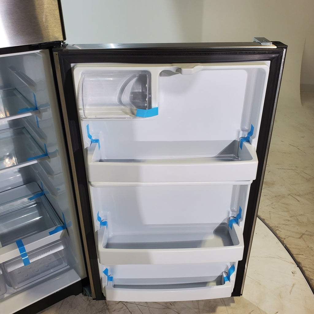 Pictures of 28" Wide Stainless Steel ENERGY STAR GE 17.5 cu. ft. Top Freezer Refrigerator with Reversible Door - Scratch & Dent - Minor - Neu Appliance Outlet - Discount Appliance Outlet in Austin, Tx