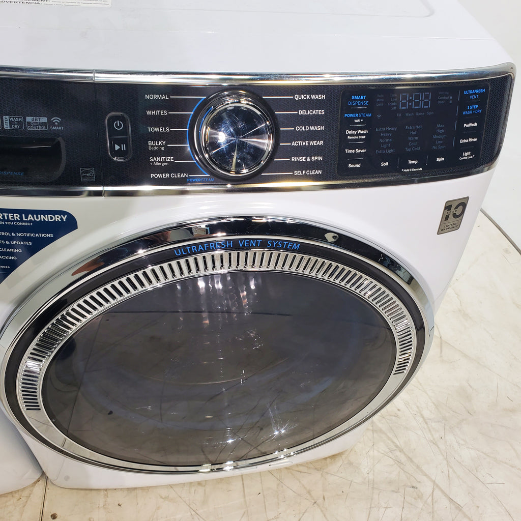 Pictures of GE ENERGY STAR 5.0 cu. ft. Capacity Smart Front Load Steam Washer with SmartDispense  and GE ENERGY STAR 7.8 cu. ft. Capacity Smart Front Load Electric Dryer with Sanitize Cycle - Scratch and Dent - Moderate / Minor - Neu Appliance Outlet - Discount Appliance Outlet in Austin, Tx