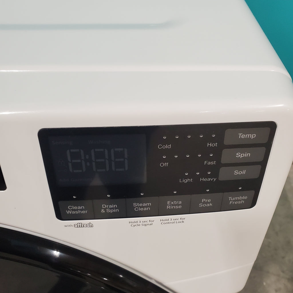 Pictures of Whirlpool Large Capacity 5.0 Cu. Ft. Front Load Washer with Quick Wash Cycle and Sanitize Cycle in White WFW6605MW - Scratch and Dent (Minor) and 7.4 Cu. Ft. Electric Wrinkle Shield Dryer with Advanced Moisture Sensing WED5605MW - Open Box - Neu Appliance Outlet - Discount Appliance Outlet in Austin, Tx