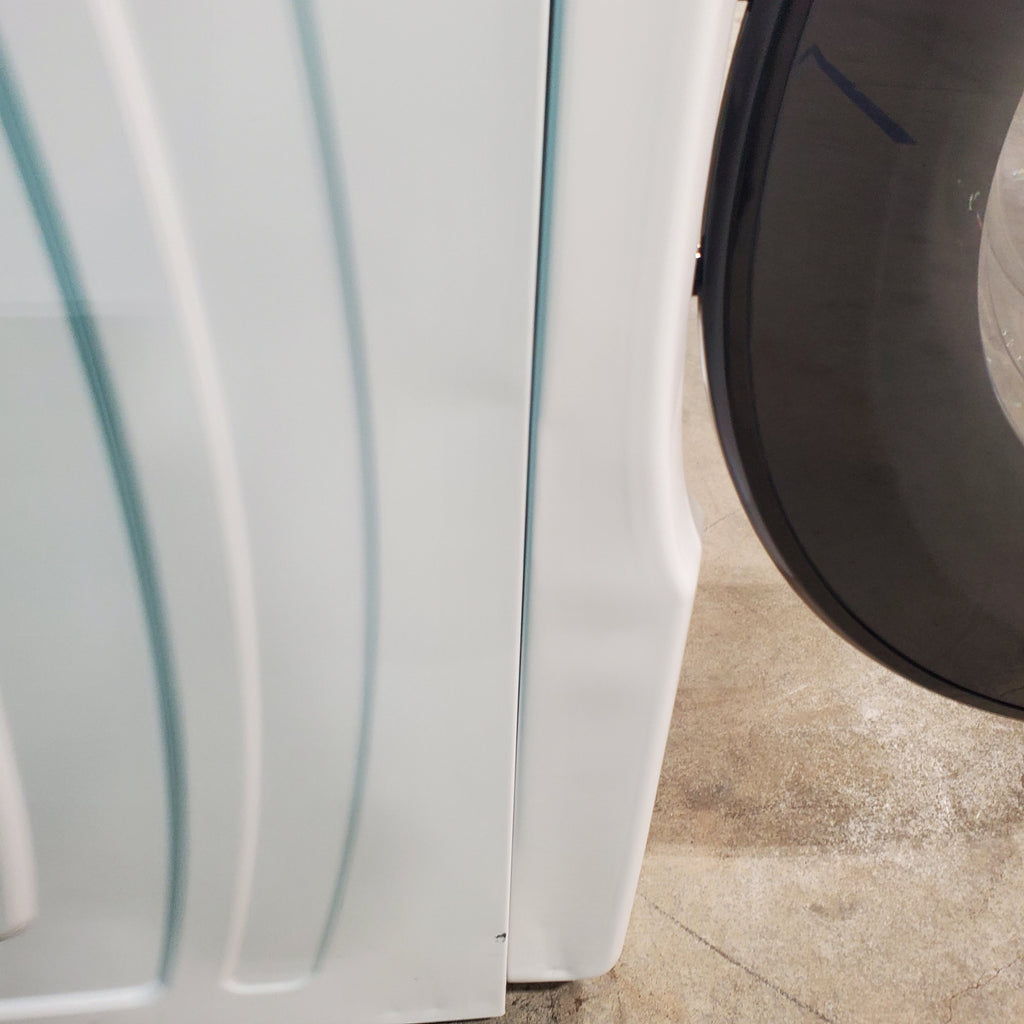 Pictures of Whirlpool Large Capacity 5.0 Cu. Ft. Front Load Washer with Quick Wash Cycle and Sanitize Cycle in White WFW6605MW - Scratch and Dent (Minor) and 7.4 Cu. Ft. Electric Wrinkle Shield Dryer with Advanced Moisture Sensing WED5605MW - Open Box - Neu Appliance Outlet - Discount Appliance Outlet in Austin, Tx