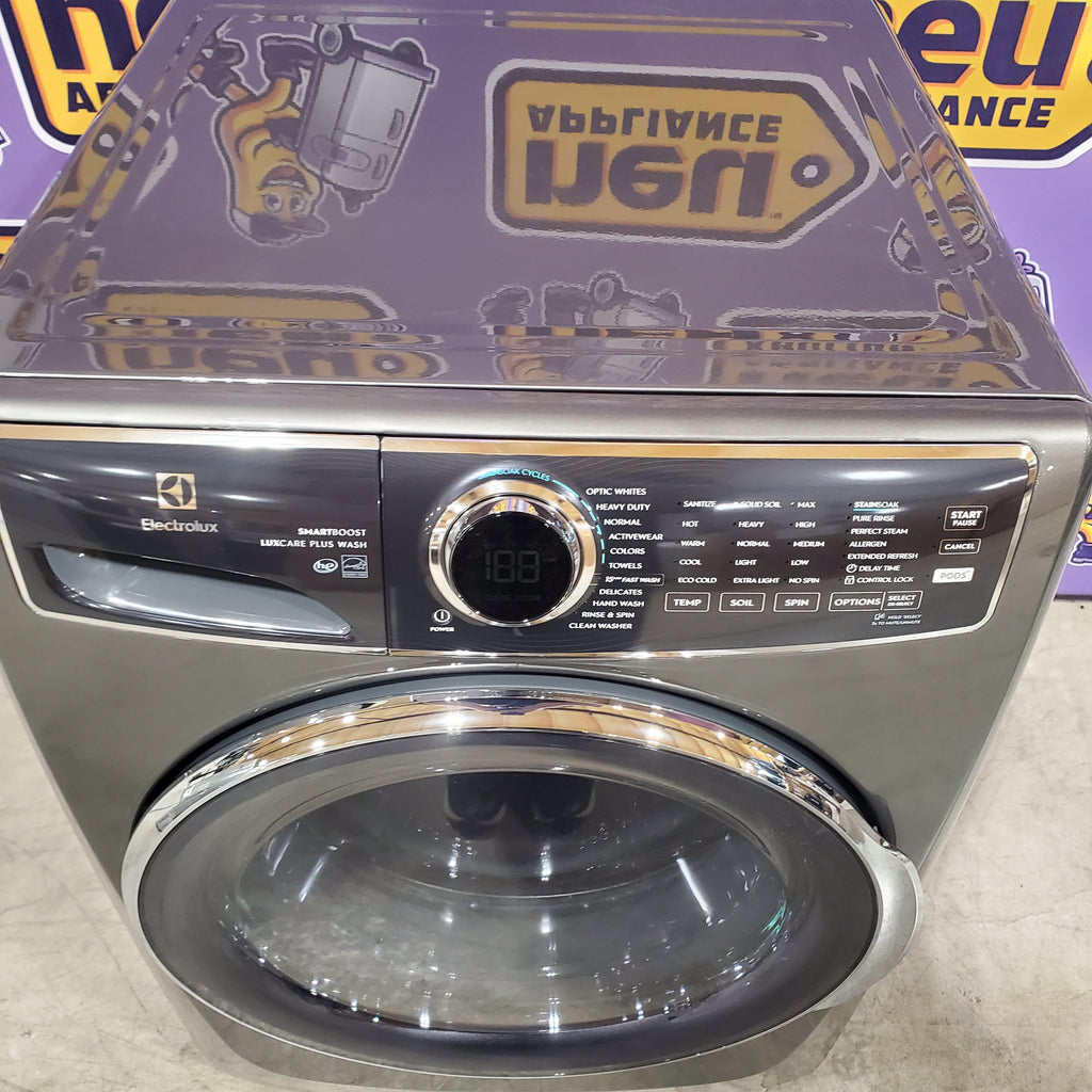 Electrolux Titanium Front Load 600 Series 4.5 Cu. Ft. Washer with Smartboost ELFW7637AT - Scratch & Dent (Minor) and Electrolux 8 cu. ft. vented Front Load Stackable 600 Series Electric Dryer with LuxCare Dry 16098 - ELFE7637AT - Scratch & Dent (Moderate)