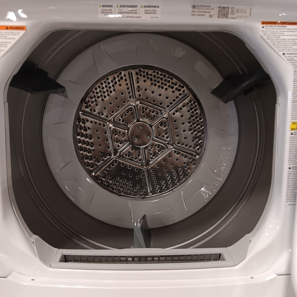 GUD27ESSMWW Top view of a washing machine drum with visible branding on the door.