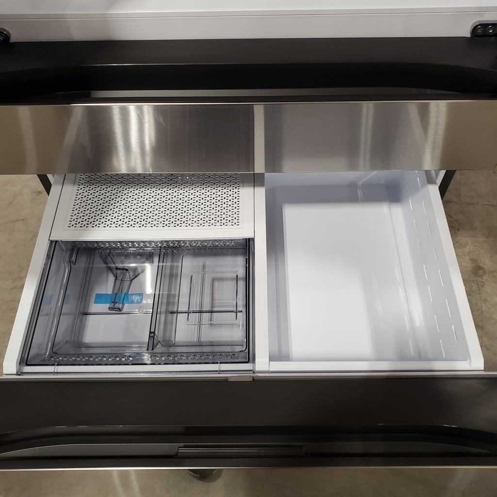 Open Samsung Bespoke 4-Door French Door RF29BB8600QL Refrigerator with interior view showing shelves and compartments.