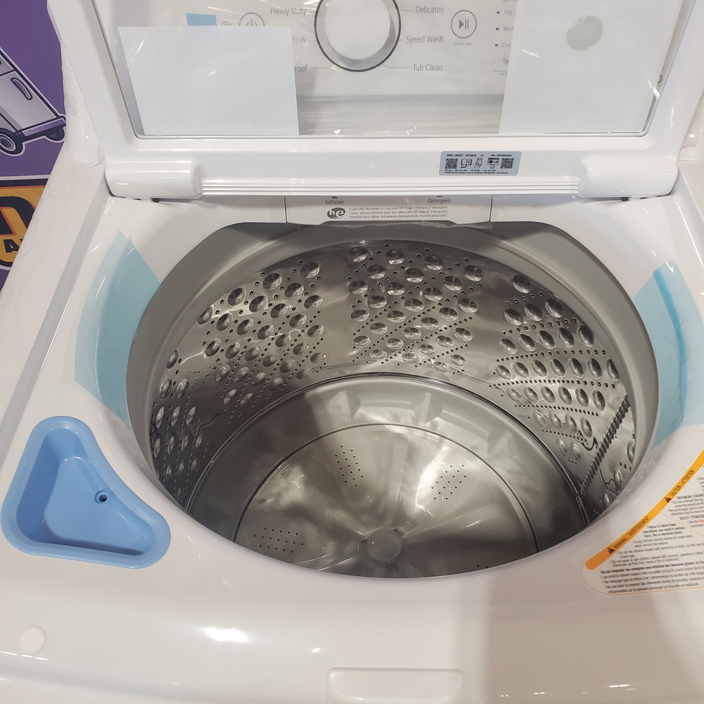 LG White Top Load 4.5 Cu. Ft. Washer with NeveRust Drum and TurboDrum Technology WT7000CW - New in Box and LG 7.3 cu. ft. Ultra Large High Efficiency Electric Dryer in White 16067 - DLE7000W - Scratch & Dent (Minor)