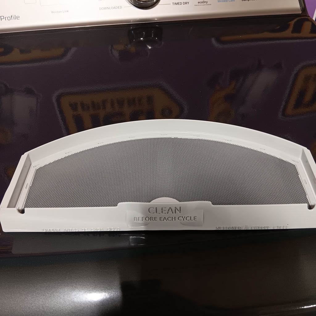 GE PTD60EBPRDG Filter with 'Clean Before Use' label on a machine