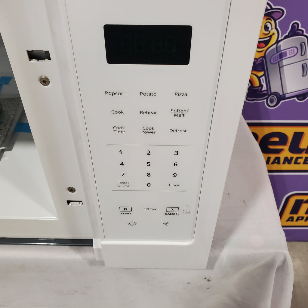 Pictures of Whirlpool 1.7 cu. ft. Microwave Hood Combination with Electronic Touch Controls 5SD287 - WMH31017HW - Scratch & Dent (Minor) - Neu Appliance Outlet - Discount Appliance Outlet in Austin, Tx