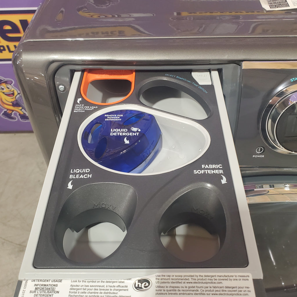 Pictures of Electrolux Titanium Front Load 600 Series 4.5 Cu. Ft. Washer with Smartboost ELFW7637AT - Scratch & Dent (Minor) and Electrolux 8 cu. ft. vented Front Load Stackable 600 Series Electric Dryer in Titanium with LuxCare Dry 16032 - ELFE7637AT - New in Box - Neu Appliance Outlet - Discount Appliance Outlet in Austin, Tx