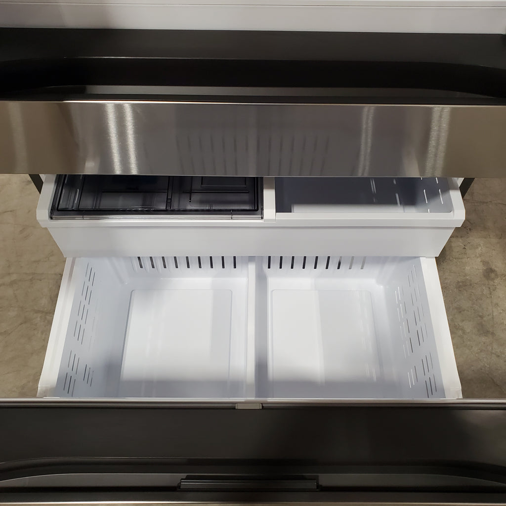 Open Samsung Bespoke 4-Door French Door RF29BB8600QL Refrigerator with interior shelves and compartments visible