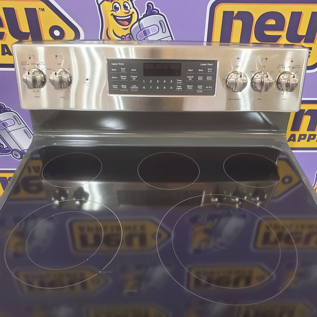 Stainless steel GE Free-Standing 30" Electric Double Oven Convection Range JBS86SPSS with control panel on a purple background with logos.