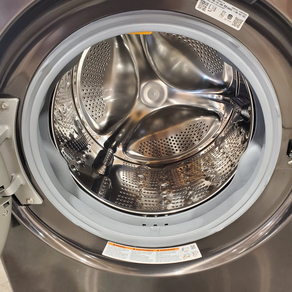 Pictures of LG ENERGY STAR WashTower Stacked Laundry Center with 4.5 cu. ft. Washer and 7.4 cu. ft. Electric Dryer in Black Steel 3SD885 - WKEX200HBA - Scratch & Dent (Minor) - Neu Appliance Outlet - Discount Appliance Outlet in Austin, Tx