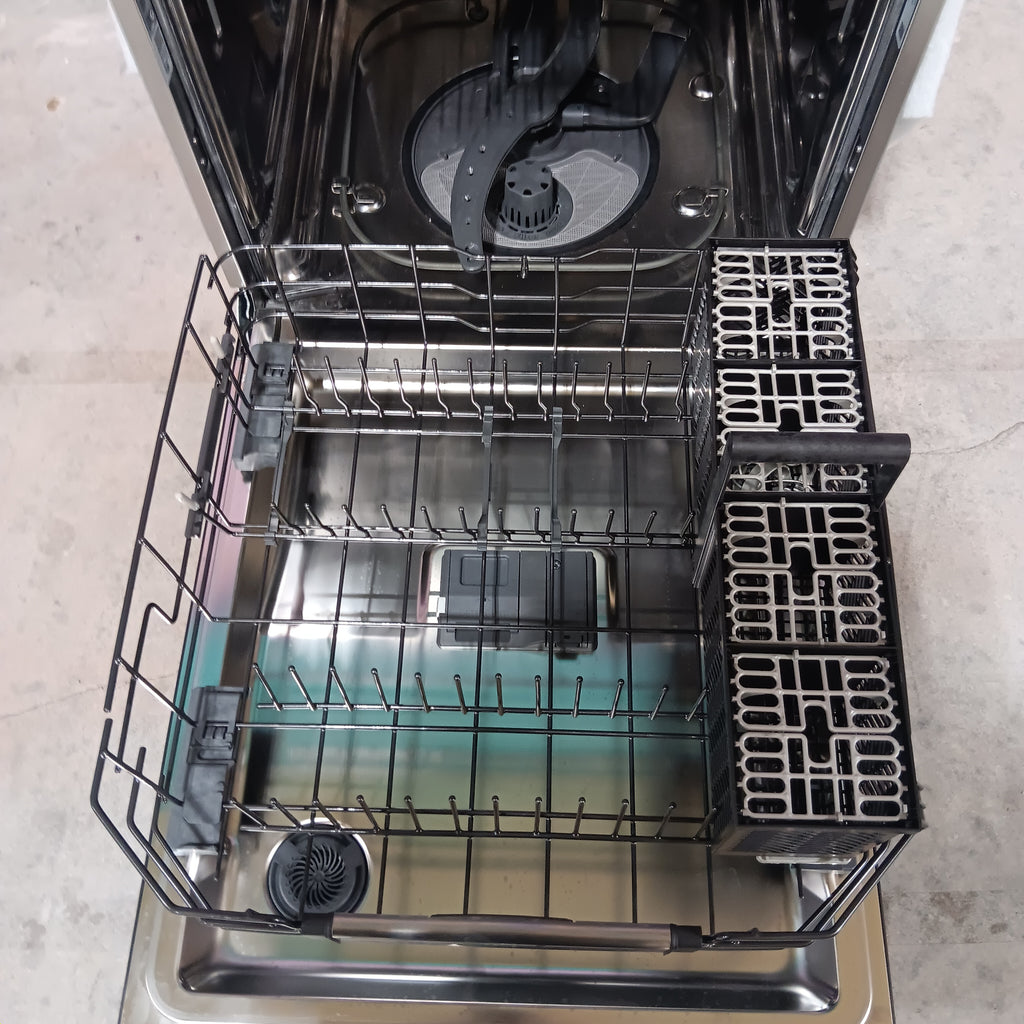 GE CDT858P3VD1 Open dishwasher with racks and compartments on a kitchen counter.
