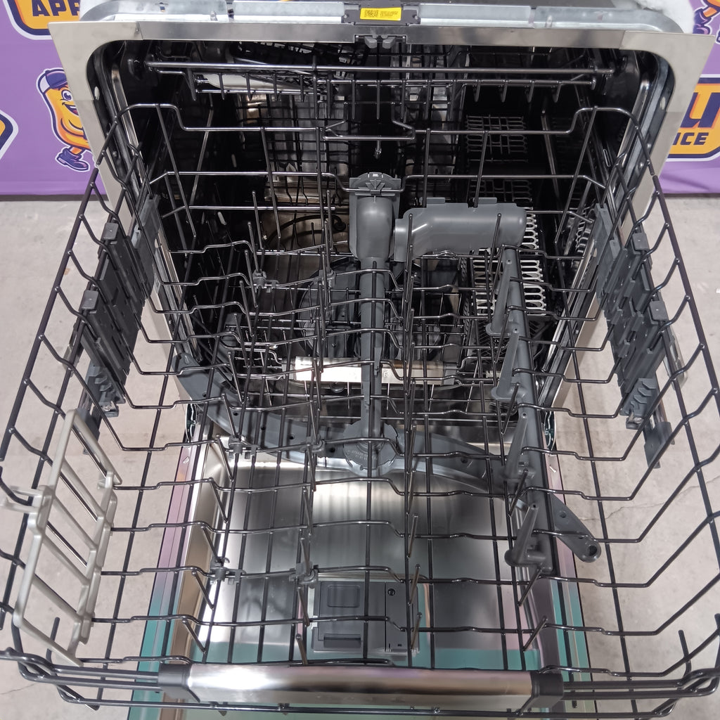 GE CDT858P3VD1 Open dishwasher interior with racks and compartments