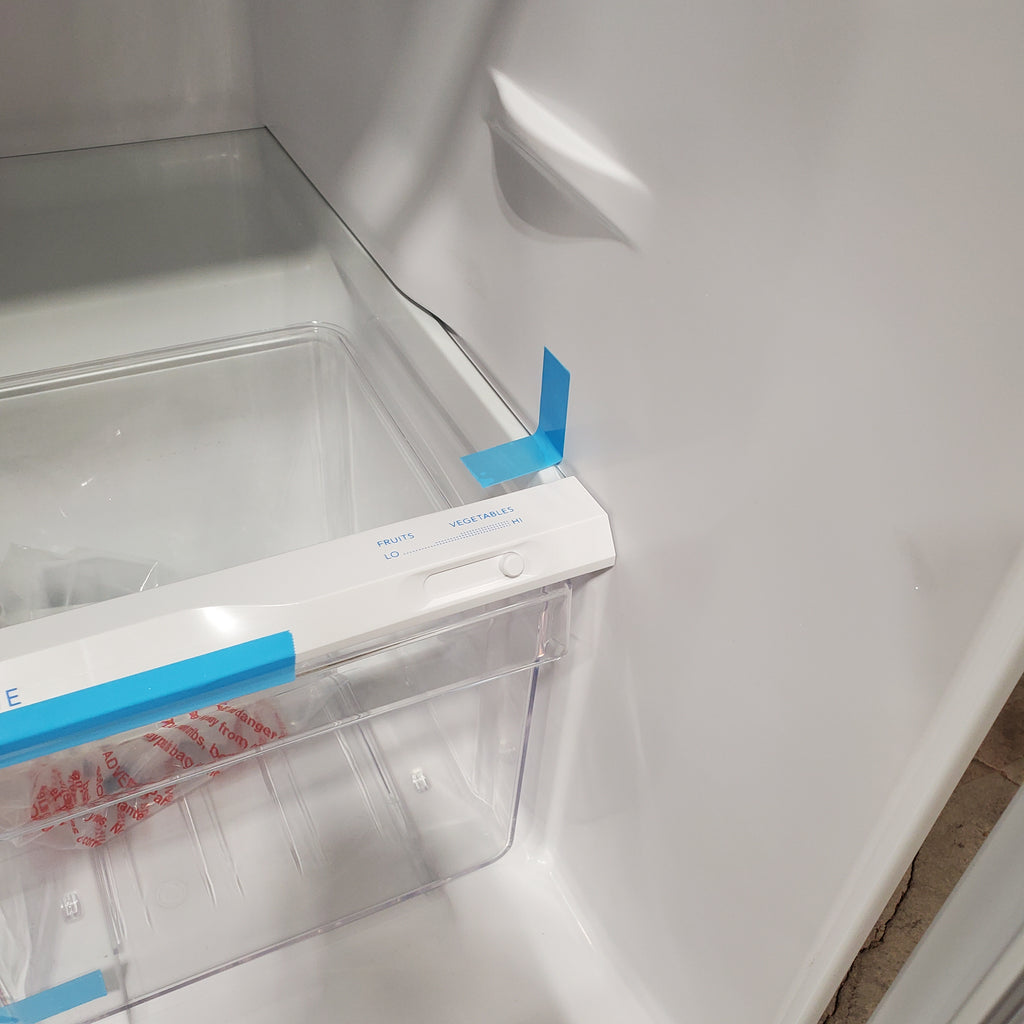 Frigidaire Top Freezer 18 Cu. Ft. Capacity Refrigerator with Spacious Interior Storage and Bright LED Lighting in White FFHT1822UW - Scratch and Dent (Minor)