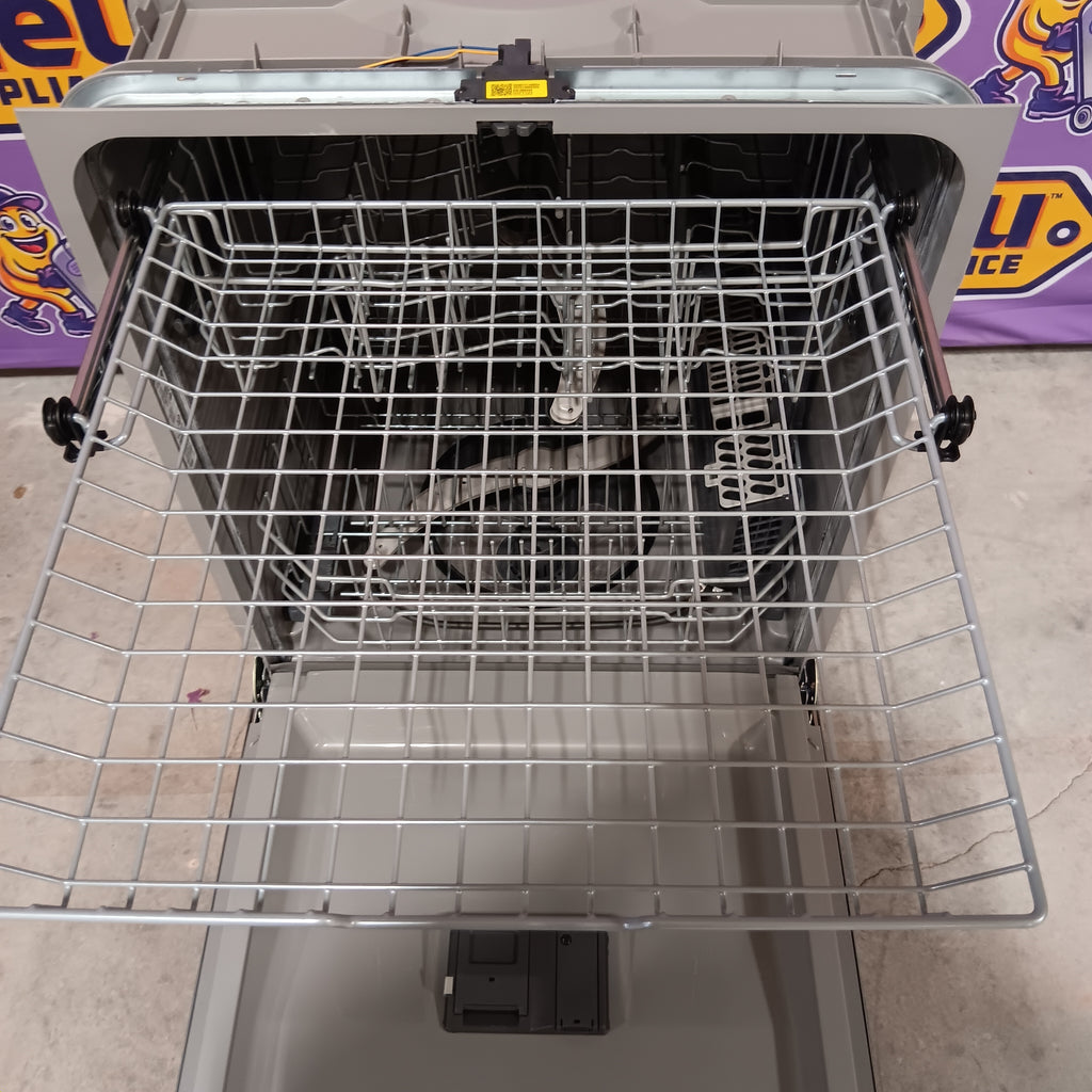 GE GDP630PYRFS Dishwasher with open door showing a wire rack inside, on a kitchen floor.