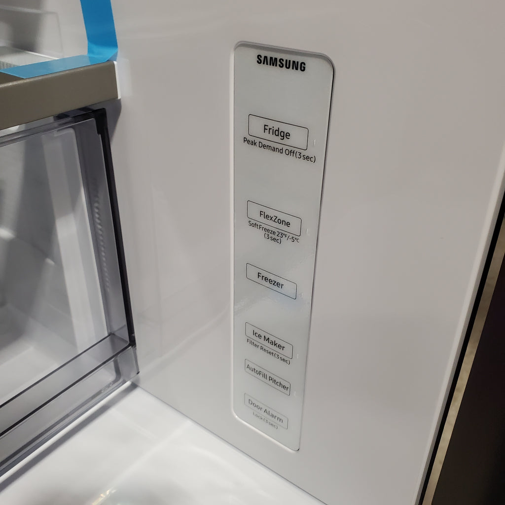 Samsung Bespoke 4-Door French Door RF29BB8600QL Refrigerator with open door showing interior labels