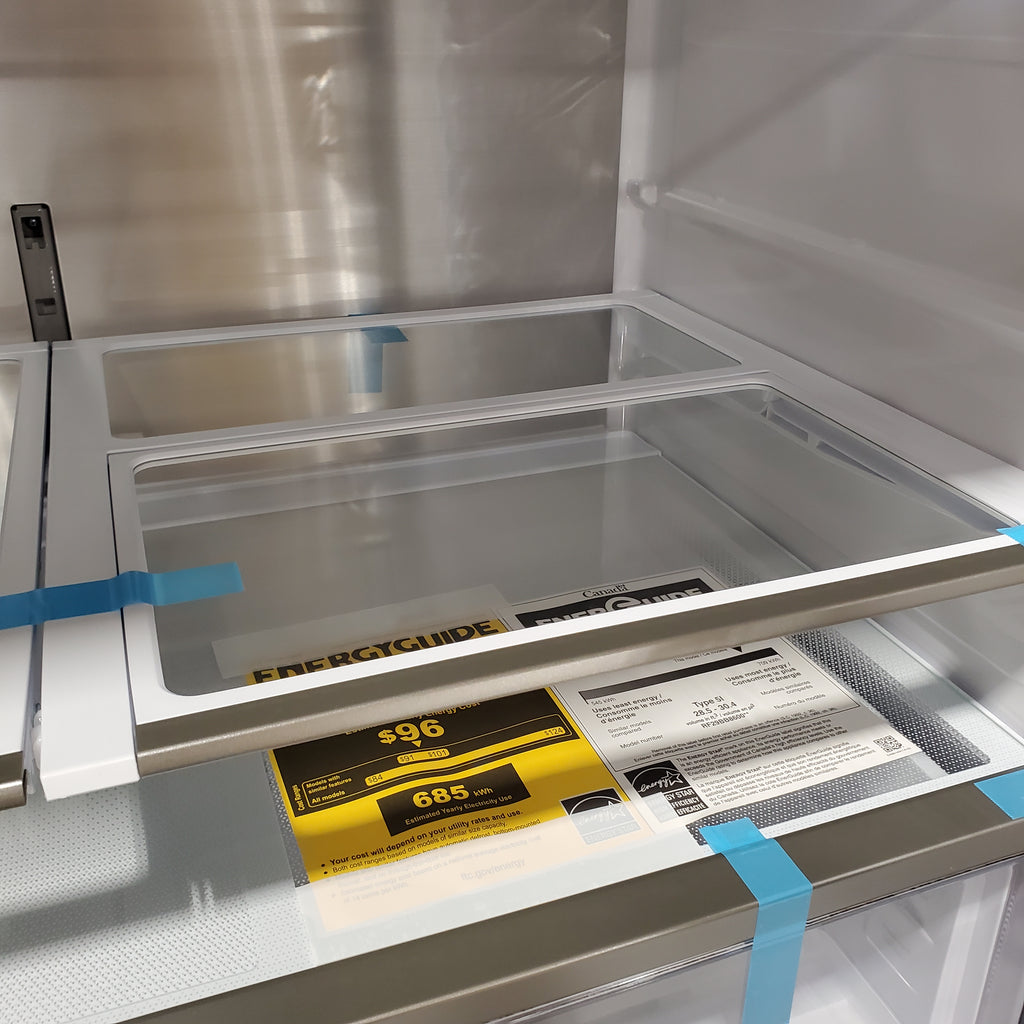 Samsung Bespoke 4-Door French Door RF29BB8600QL Refrigerator with a yellow label on the door