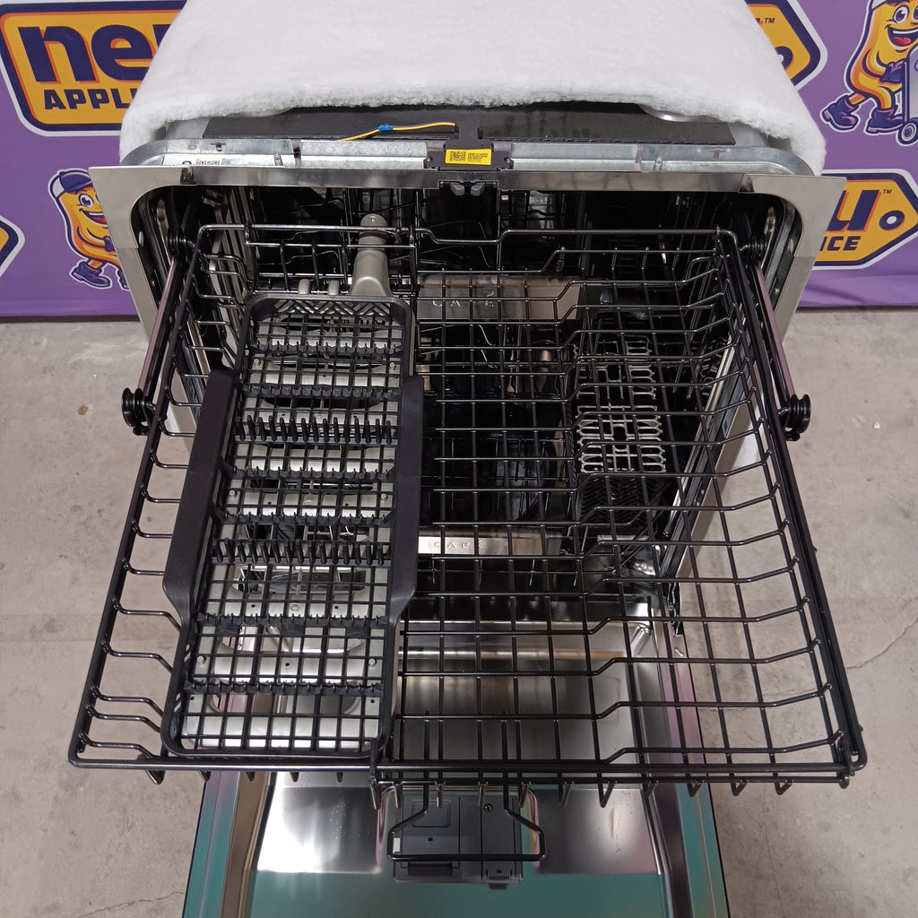 GE CDT858P3VD1 Open dishwasher with racks inside, showing the interior structure.