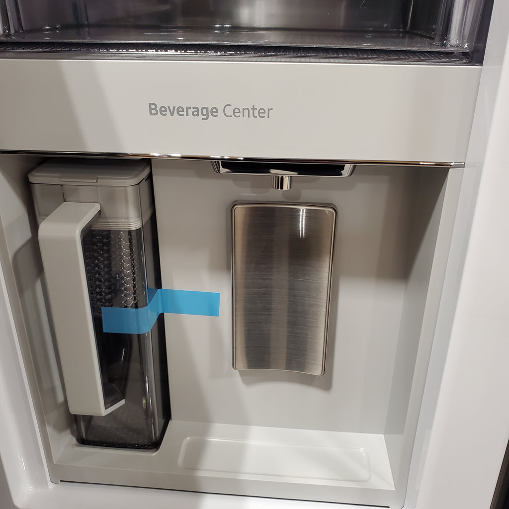 Beverage center on a Samsung Bespoke 4-Door French Door RF29BB8600QL Refrigerator with open door showing ice maker and 'Beverage Center' text.