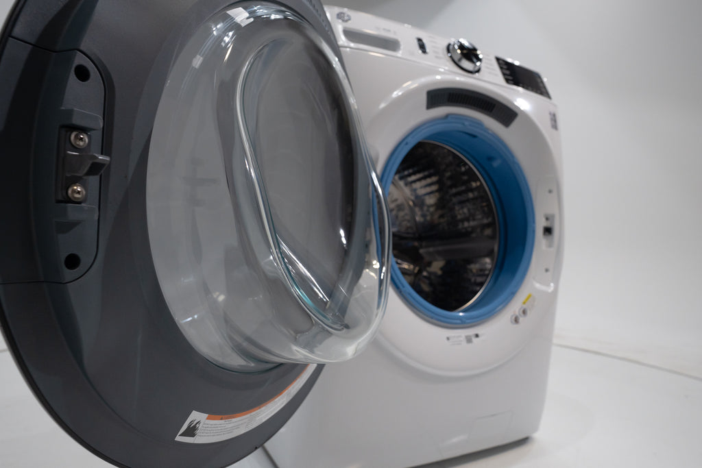GE GFW550SSNWW Washing machine with open door on a white background